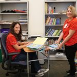 Volunteers organizing children books