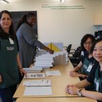 Kohl Children's Museum Volunteers organizing binders