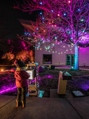 Small child changing the color of lights